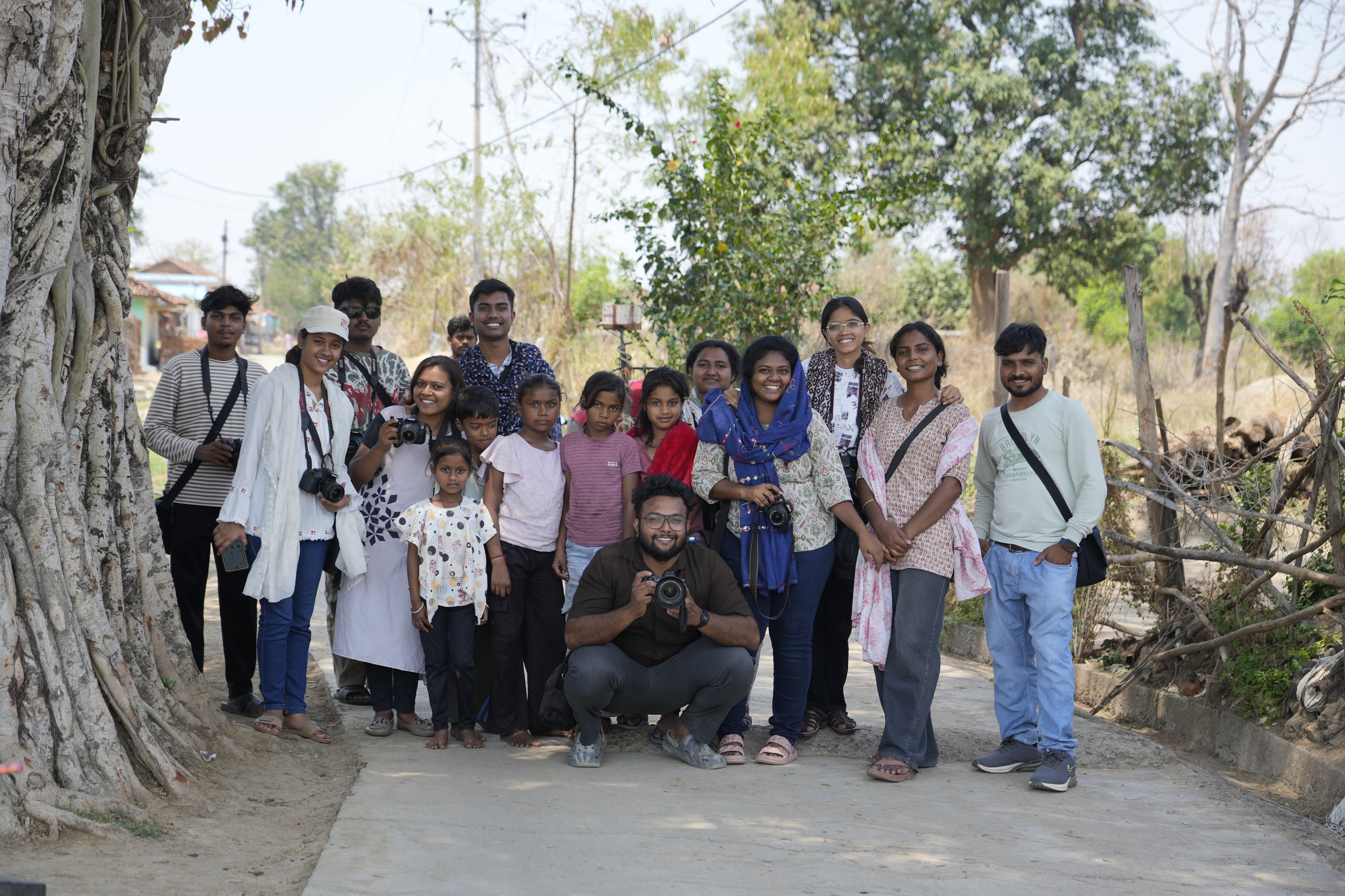 Young participant holding a camera during a CICADA workshop